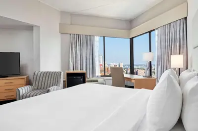 a hotel room with a bed and a large window at DoubleTree by Hilton Hotel Philadelphia Center City in Philadelphia