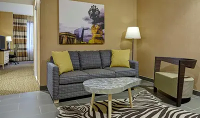 a living room with a couch and a table at DoubleTree by Hilton Hotel Philadelphia Center City in Philadelphia