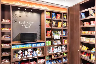 a grocery store aisle with a chalkboard on the wall at Hampton Inn & Suites Valley Forge/Oaks in Phoenixville
