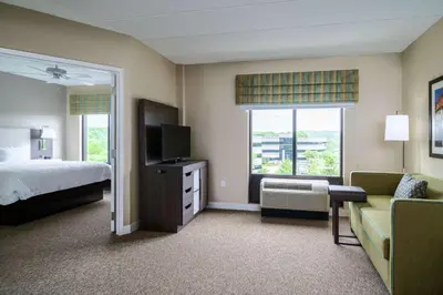 a hotel room with a bed and a television at Hampton Inn & Suites Valley Forge/Oaks in Phoenixville