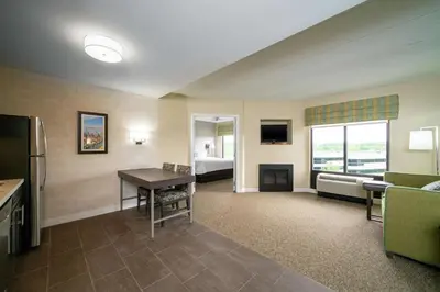 a living room with a room with a couch and a table at Hampton Inn & Suites Valley Forge/Oaks in Phoenixville