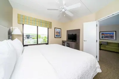 a bedroom with a large white bed and a window at Hampton Inn & Suites Valley Forge/Oaks in Phoenixville