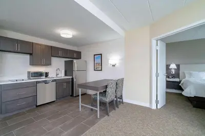 a kitchen with a table and a bed in a room at Hampton Inn & Suites Valley Forge/Oaks in Phoenixville