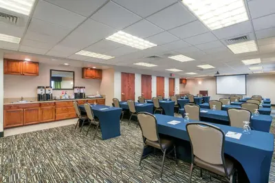 a conference room with blue tables and chairs at Hampton Inn & Suites Valley Forge/Oaks in Phoenixville