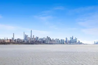a view of a large city from the water at Homewood Suites by Hilton Edgewater-NYC Area in Edgewater