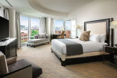 a hotel room with a bed and a television at The Inn at Penn, A Hilton Hotel in Philadelphia