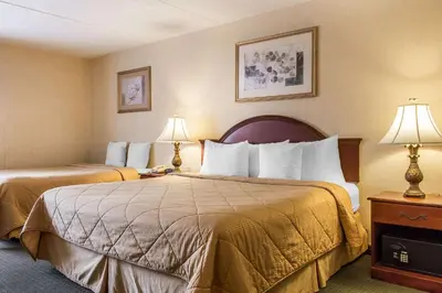 a hotel room with two beds and two lamps at Quality Inn Hackettstown - Long Valley in Hackettstown