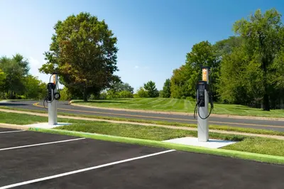 two parking meters in a parking lot next to a road at Hilton Garden Inn Kennett Square in Kennett Square