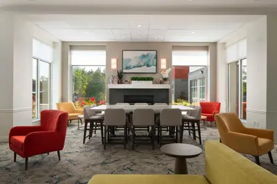 a dining room with a table and chairs at Hilton Garden Inn Kennett Square in Kennett Square