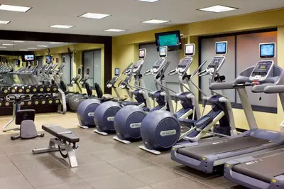 a gym with a row of treadmills and machines at DoubleTree by Hilton Hotel & Executive Meeting Center Somerset in Somerset