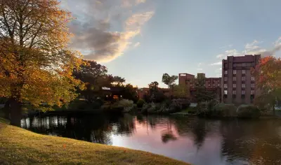 a view of a river in a city with buildings at Hilton Parsippany in Parsippany