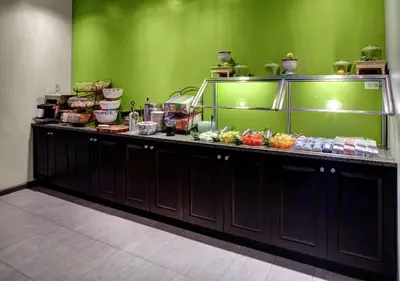 a buffet line with food on top of it at Hilton Garden Inn New York/Manhattan-Chelsea in New York