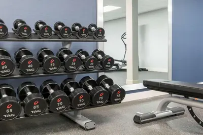 a rack of dumbbells in a gym at Homewood Suites by Hilton Mount Laurel in Mount Laurel