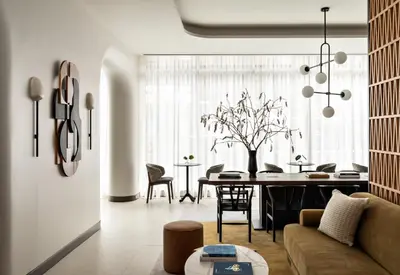 a living room with a couch and a table at Kimpton Theta New York - Times Square by IHG in New York