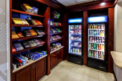 a refrigerator with lots of food and drinks in it at Hampton Inn & Suites Staten Island in Staten Island