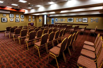 a room with rows of chairs and pictures on the walls at Hampton Inn & Suites Staten Island in Staten Island