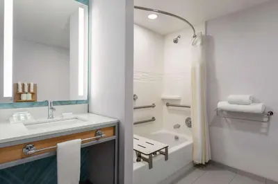 a bathroom with a sink and a tub and a shower at Hilton Garden Inn Bridgewater in Bridgewater
