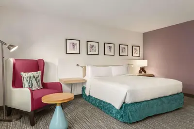 a hotel room with a bed and a chair at Hilton Garden Inn Bridgewater in Bridgewater