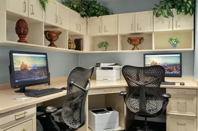 an office with two desks with two computer monitors at Hilton Garden Inn Bridgewater in Bridgewater