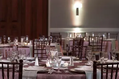 a long table with plates and wine glasses on it at DoubleTree by Hilton Philadelphia Airport in Philadelphia