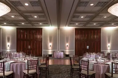 a room with tables and chairs in a room at DoubleTree by Hilton Philadelphia Airport in Philadelphia