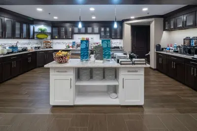 a large kitchen with a large white counter top at Homewood Suites by Hilton Philadelphia-Valley Forge in Audubon