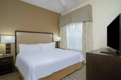 a hotel room with a bed and a television at Homewood Suites by Hilton Philadelphia-Valley Forge in Audubon