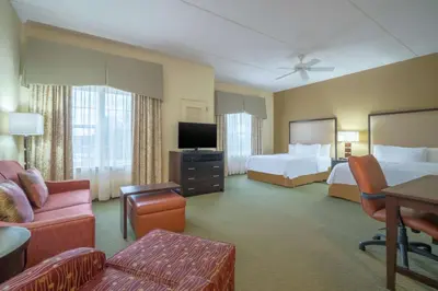 a hotel room with two beds and a television at Homewood Suites by Hilton Philadelphia-Valley Forge in Audubon