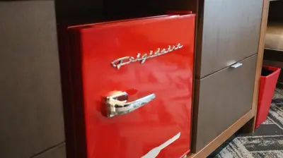 an old red refrigerator with a toy car on the door at The Alder in Monticello