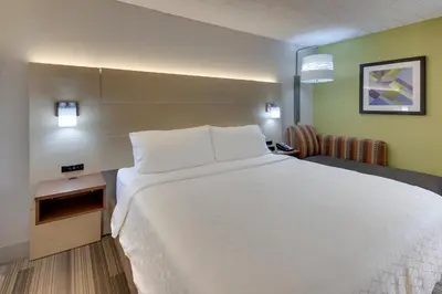 a large white bed in a hotel room at Holiday Inn Express Pittston - Scranton Airport by IHG in Pittston