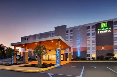 a hotel with a parking lot in front of it at Holiday Inn Express Pittston - Scranton Airport by IHG in Pittston