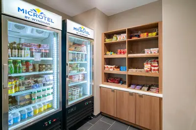 a store with two refrigerators in a room at Microtel Inn & Suites by Wyndham Carlisle in Carlisle