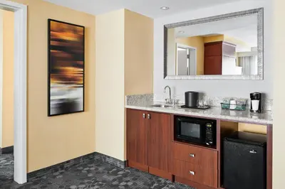 a kitchen with a sink and a microwave at Courtyard by Marriott Newark Downtown in Newark