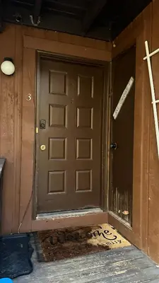 a front door of a house with graffiti on it at Ski on Ski off Mtn Chalet in Vernon