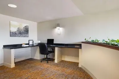 an office with a desk with a computer and a chair at Best Western Grand Victorian Inn in Sayre