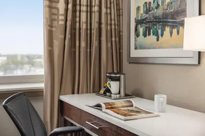 a table in a hotel room with a coffee maker on it at Hilton Philadelphia City Avenue in Philadelphia