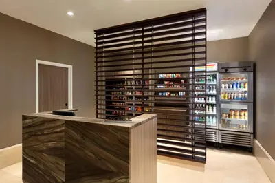 a wine bar with a large wall of wine bottles at Hilton Philadelphia City Avenue in Philadelphia