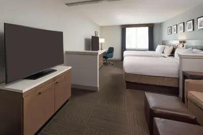 a hotel room with a bed and a flat screen tv at Hilton Garden Inn Philadelphia Center City in Philadelphia
