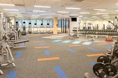 a gym with lots of equipment on the floor at Holiday Inn Express Princeton Southeast by IHG in Plainsboro