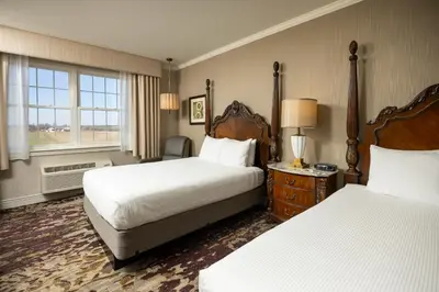 a hotel room with two beds and a window at AmishView Inn & Suites in Bird in Hand