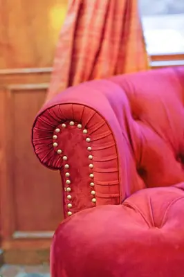 a close up of the back of a red couch at Hotel St. James in New York