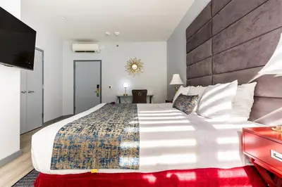 a bedroom with a large bed with a large headboard at Hotel St. James in New York