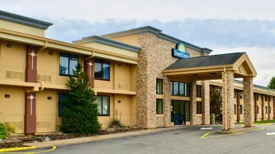 a hotel building with a sign on it at Days Inn by Wyndham Wayne in Wayne