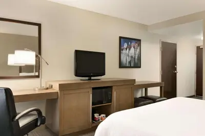 a hotel room with a bed and a television at Hampton Inn & Suites Hershey in Hershey