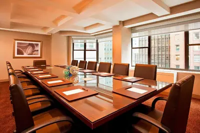 a large conference room with a long table and chairs at The Westin New York Grand Central in New York