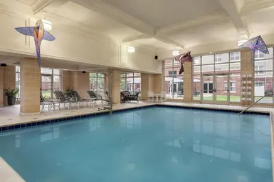 a large swimming pool with kites in a building at Homewood Suites by Hilton Harrisburg East-Hershey Area in Harrisburg