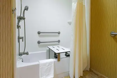 a bathroom with a shower and a bath tub at Larkspur Landing Carlisle in Carlisle