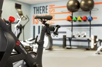 a gym with several exercise bikes in a room at Hampton Inn Lancaster in Lancaster