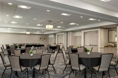 a conference room with tables and chairs in it at Hilton Garden Inn Harrisburg East in Harrisburg