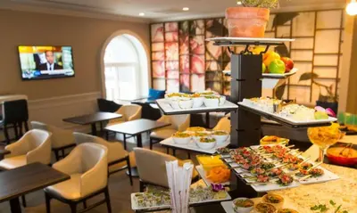 a buffet of food on display in a restaurant at Hilton Wilmington/Christiana in Newark